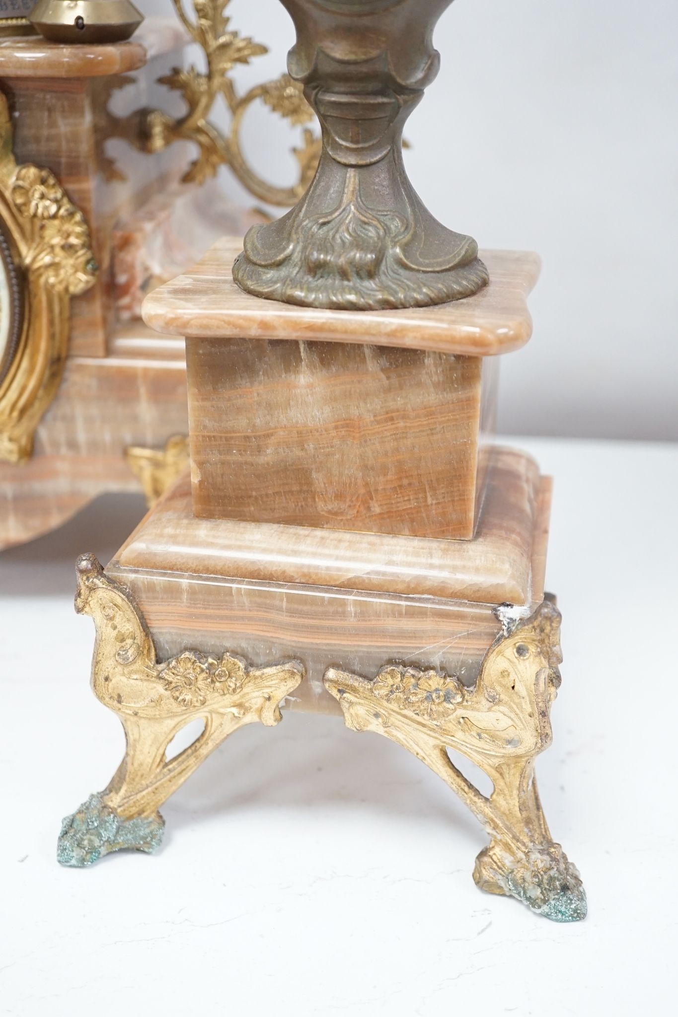 A French onyx and spelter figural clock garniture 66cm